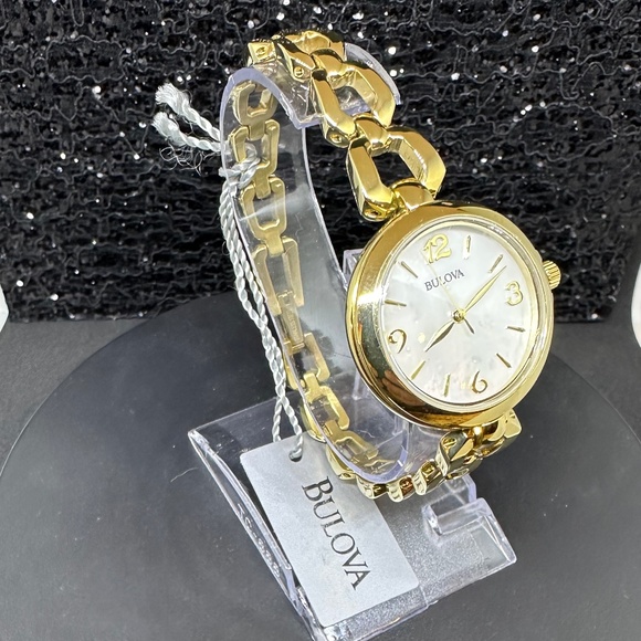 Women's (NWT) Bulova w/Mother-of Pearl Face, Gold Bezel, and Gold Chain Bracelet - Picture 3 of 5
